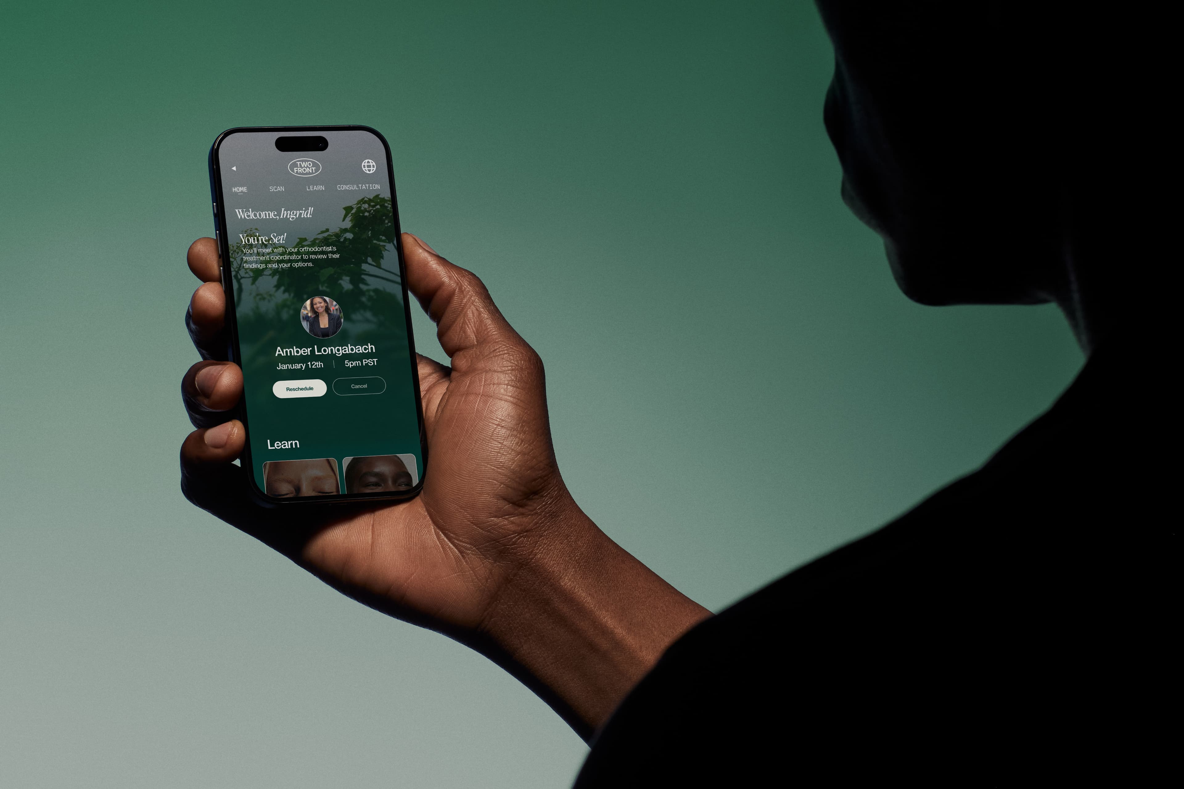 Person holding phone with Two Front app